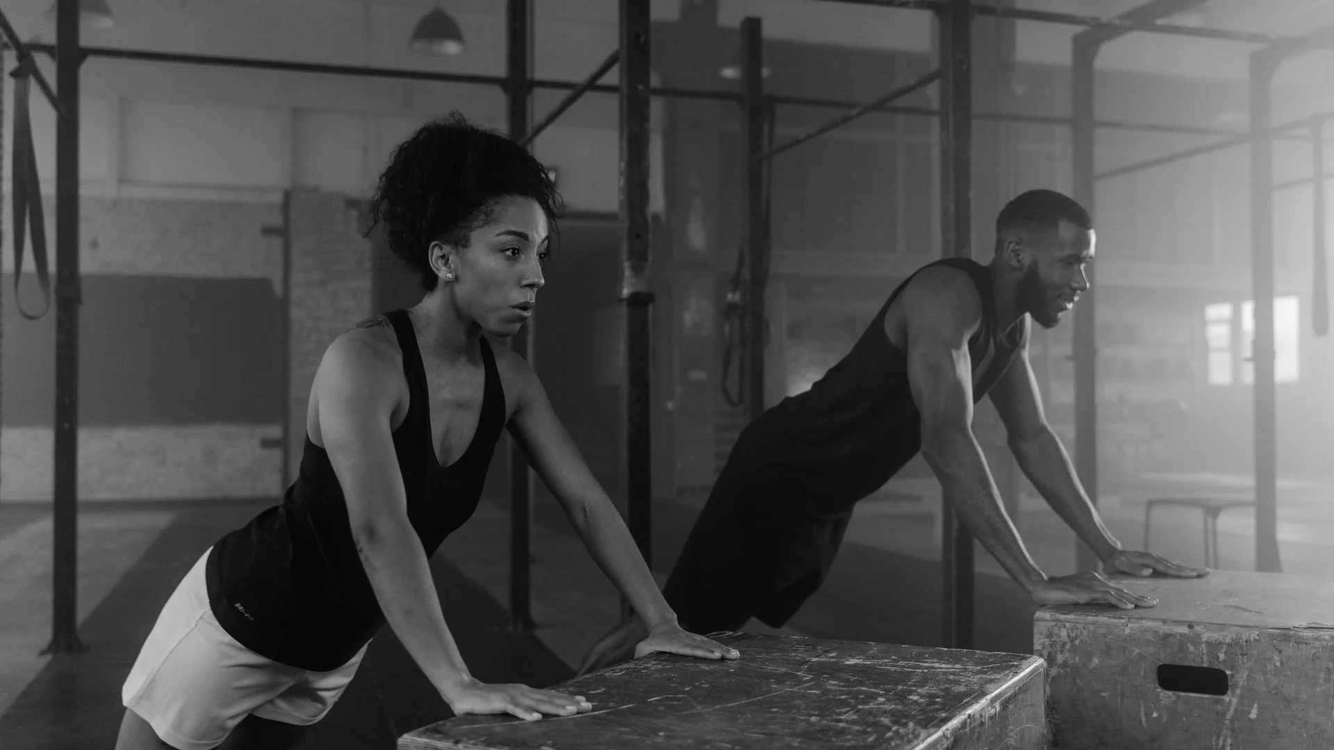 African men and women training together in a modern gym